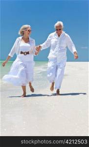 Happy Senior Couple Running Holding Hands on A Tropical Beach