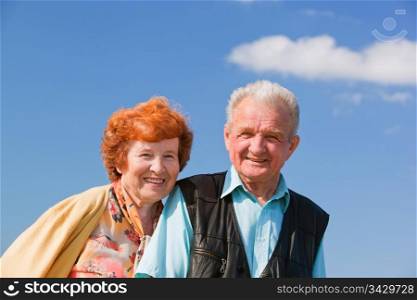 Happy senior couple together in love, outside, blue sky