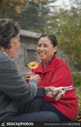 Happy Senior couple with flower