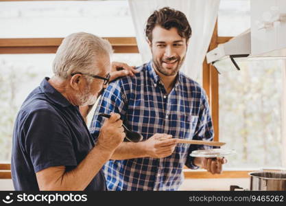 Happy senior elderly man enjoy cooking with family at the kitchen for stay home leisure activity and lifestyle of people.