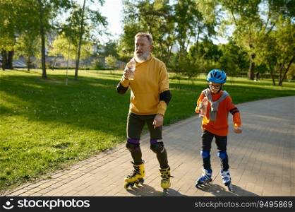 Happy senior man and little boy rollerskating in urban park. Grandfather and grandson enjoying sports during hot summer day. Happy senior man and little boy rollerskating in urban park