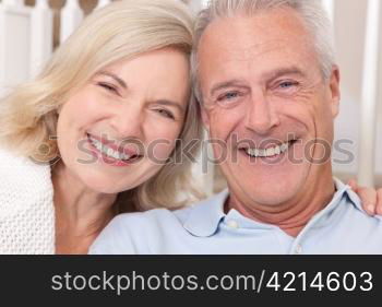 Happy Senior Man & Woman Couple Smiling at Home