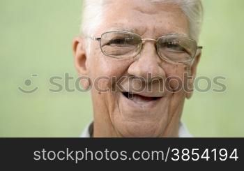 Happy senior people, elderly man with glasses looking at camera and smiling. Sequence