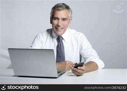 happy senior smiling businessman laptop computer mobile phone portrait