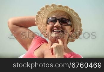 Happy senior woman looking at camera, smiling.