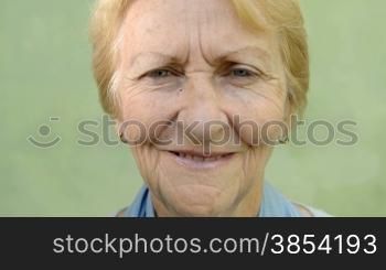 Happy seniors, elderly blonde woman looking at camera. Sequence