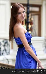 Happy sexy woman in blue dress