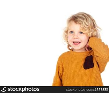 Happy small boy scratching his head isolated on a white background