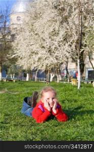 Happy small girl in spring recreation ground