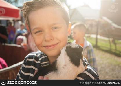 happy smiling boy with cavy. Portrait of happy smiling boy with cavy. Sunny day.