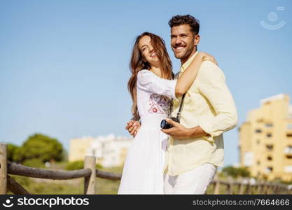 Happy smiling couple hugging each other outdoors. Happy loving couple hugging each other outdoors