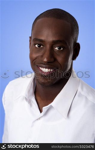 Happy smiling face of a handsome African American business man wearing a white shirt, isolated.