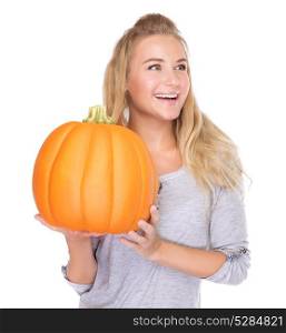 Happy smiling female holding in hands ripe orange pumpkin, isolated on white background, enjoying traditional Thanksgiving day food