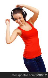 Happy smiling girl dancing and listening to music