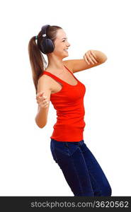 Happy smiling girl dancing and listening to music