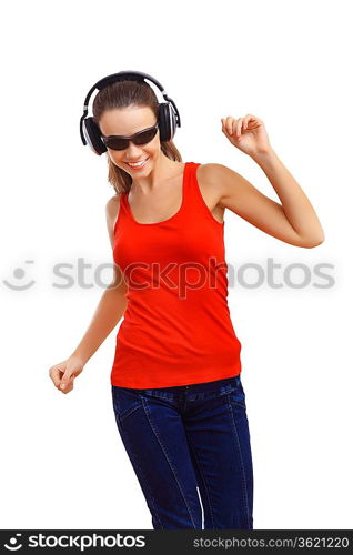 Happy smiling girl dancing and listening to music