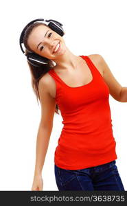 Happy smiling girl dancing and listening to music