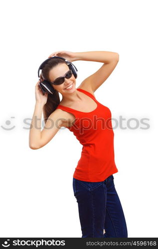 Happy smiling girl dancing and listening to music