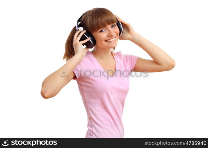 Happy smiling girl dancing and listening to music