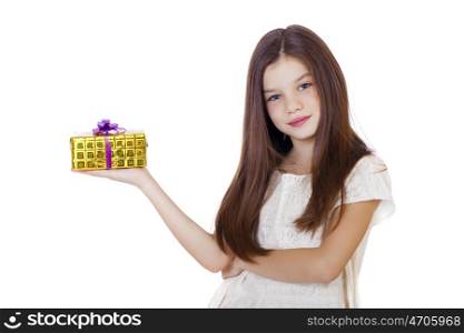 Happy smiling little girl holding and offering a gift for Christmas and birthday isolated on white background