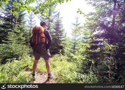 happy smiling man hiker at the mountains. Carpathians, Ukraine.