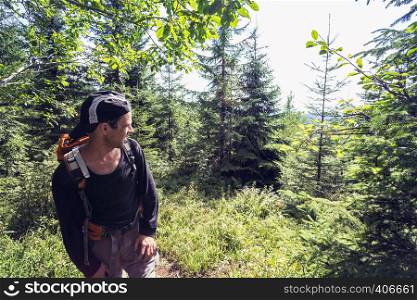 happy smiling man hiker at the mountains. Carpathians, Ukraine.