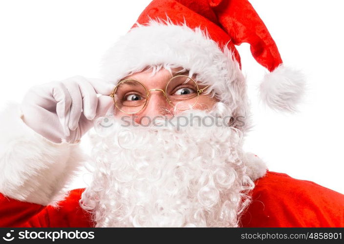 Happy smiling Santa Claus holding glasses and looking at camera, isolated on white