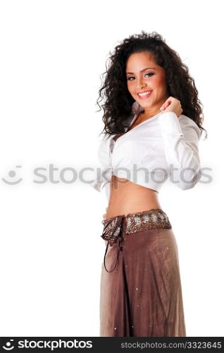 Happy smiling sexy beautiful Caucasian Hispanic Latina young woman with brown curley hair. Cute tanned brunette, ethnic girl in white knotted shirt and brown skirt dancing showing belly button, isolated.