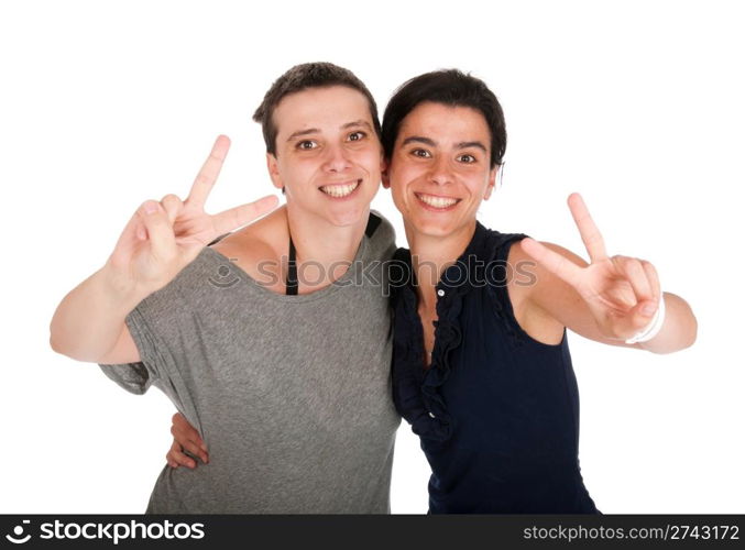 happy smiling sisters showing victory hand sign, isolated on white background