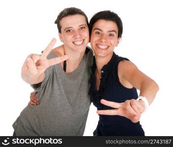 happy smiling sisters showing victory hand sign, isolated on white background