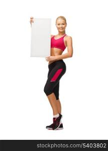happy smiling sportswoman with white blank board