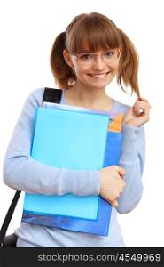 Happy smiling student standing and holding books