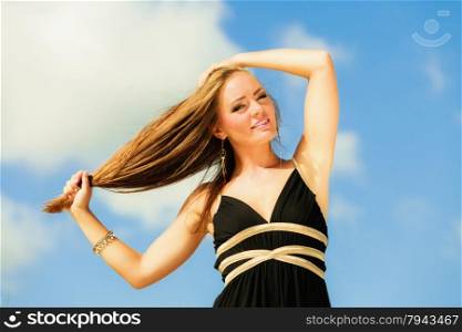 Happy smiling woman outdoor. Vacation day leisure concept. Positive young person outside on beach.