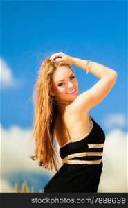 Happy smiling woman outdoor. Vacation day leisure concept. Possitive young person outside on beach.