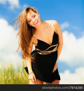 Happy smiling woman outdoor. Vacation day leisure concept. Possitive young person outside on beach.