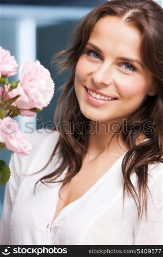 happy smiling woman with bouquet of flowers at home.