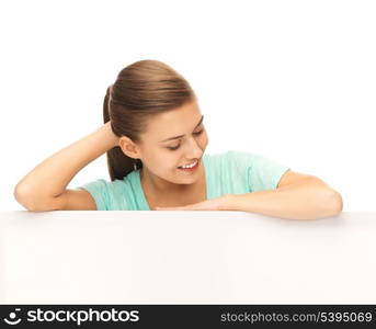 happy smiling woman with white blank board