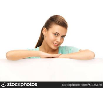 happy smiling woman with white blank board