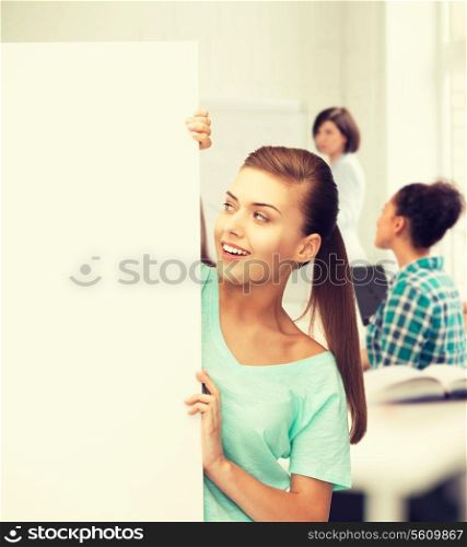 happy smiling woman with white blank board at school