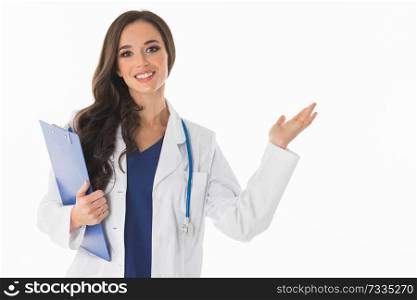 Happy smiling young beautiful female doctor showing blank area for sign or copyspace , isolated over white background. Female doctor showing blank area