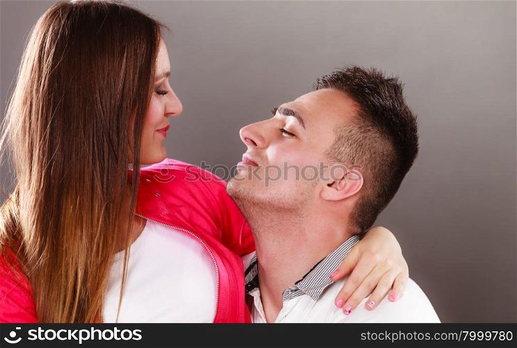 Happy smiling young couple hugging. Love.. Happy smiling young couple hugging embracing. Joyful man and woman having nice time. Love. Good relationship.