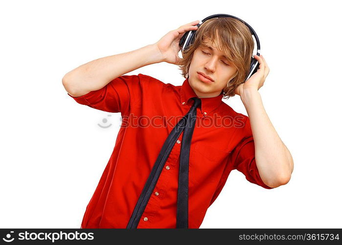 Happy smiling young man dancing and listening to music