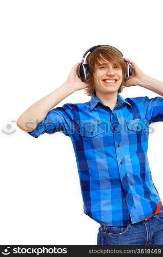 Happy smiling young man dancing and listening to music