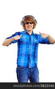 Happy smiling young man dancing and listening to music