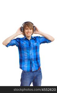 Happy smiling young man dancing and listening to music