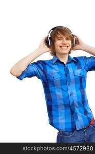 Happy smiling young man dancing and listening to music