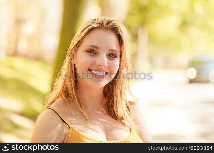 Happy smiling young woman outdoor. Pretty attractive girl portrait.. Happy young woman girl outdoor.