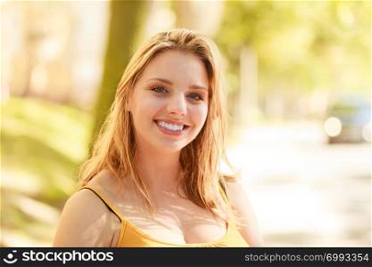 Happy smiling young woman outdoor. Pretty attractive girl portrait.. Happy young woman girl outdoor.
