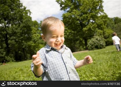 Happy Smilling Little Boy In The Park