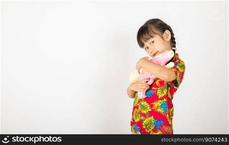 Happy Songkran Day, Asian kid girl with floral shirt hold water gun, Thaiχld funny hold toy waterπstol and smi≤, isolated on white background, Thailand Songkran festival national cu<ure concept
